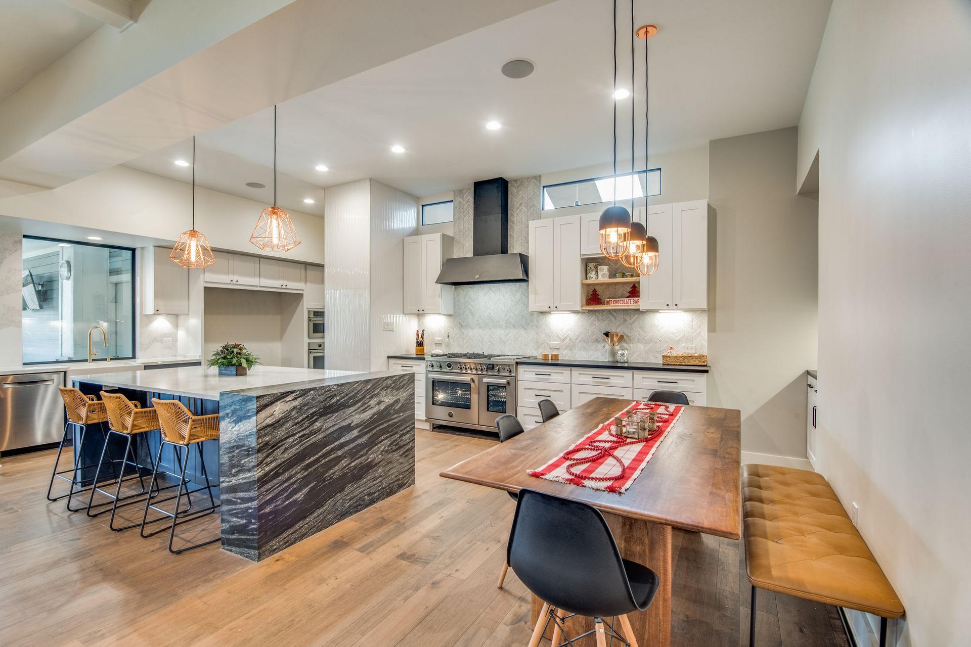 A kitchen with a table and chairs in it.