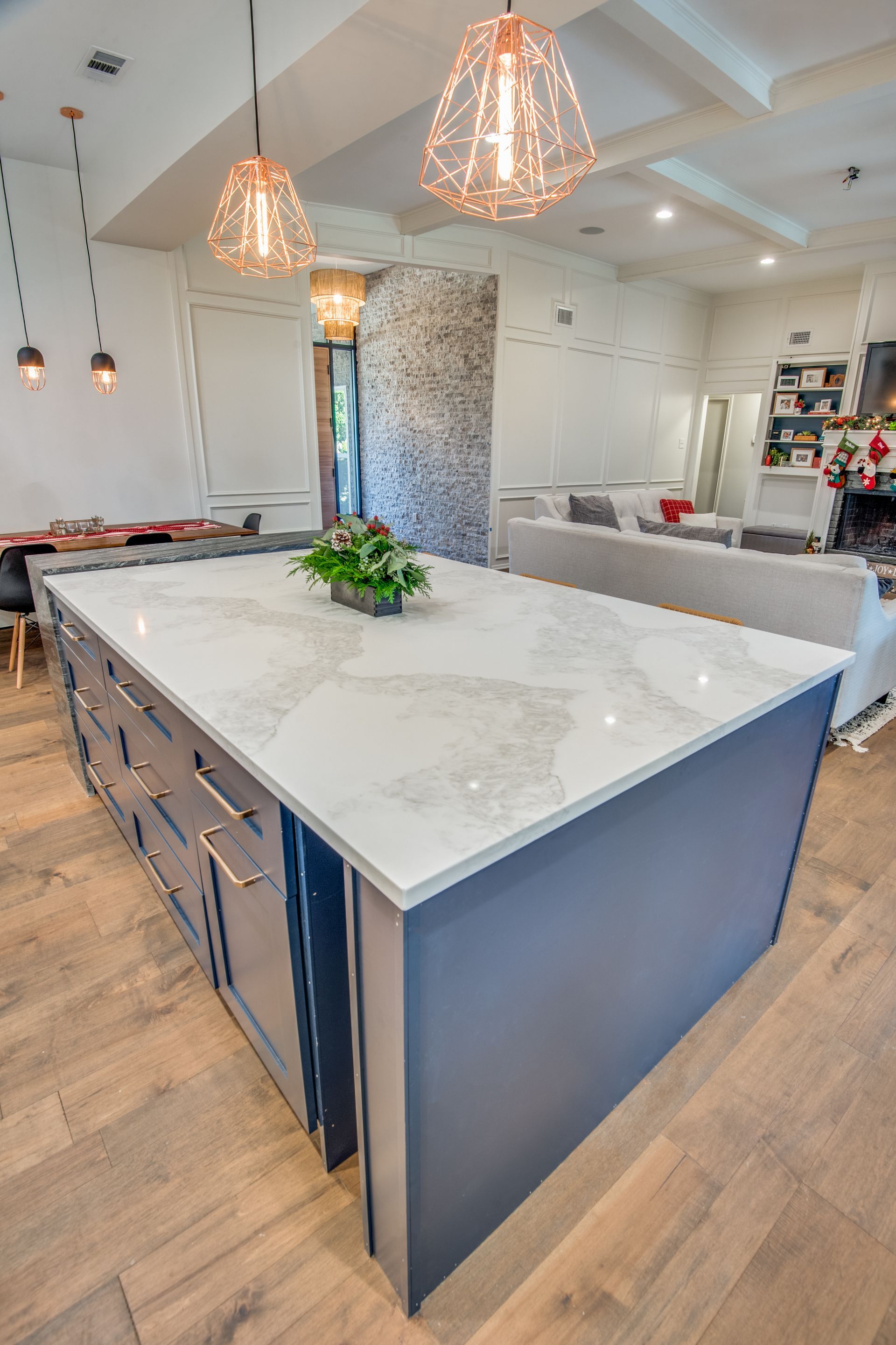 There is a large island in the middle of the kitchen.