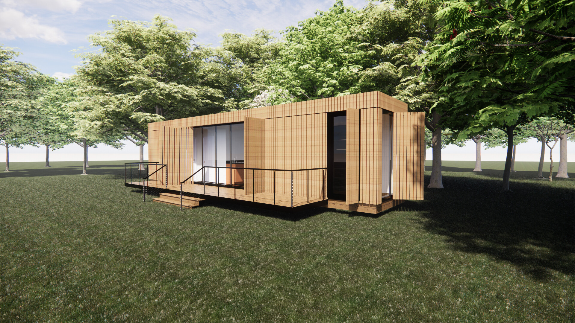 A shipping container  house is sitting on top of a lush green field surrounded by trees.