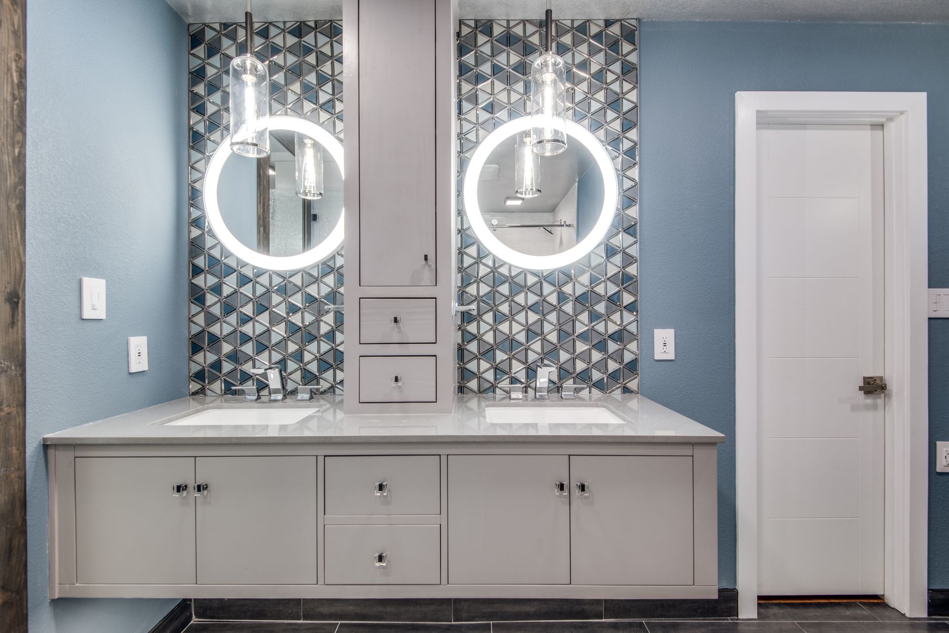 A bathroom remodel with two sinks and two mirrors.