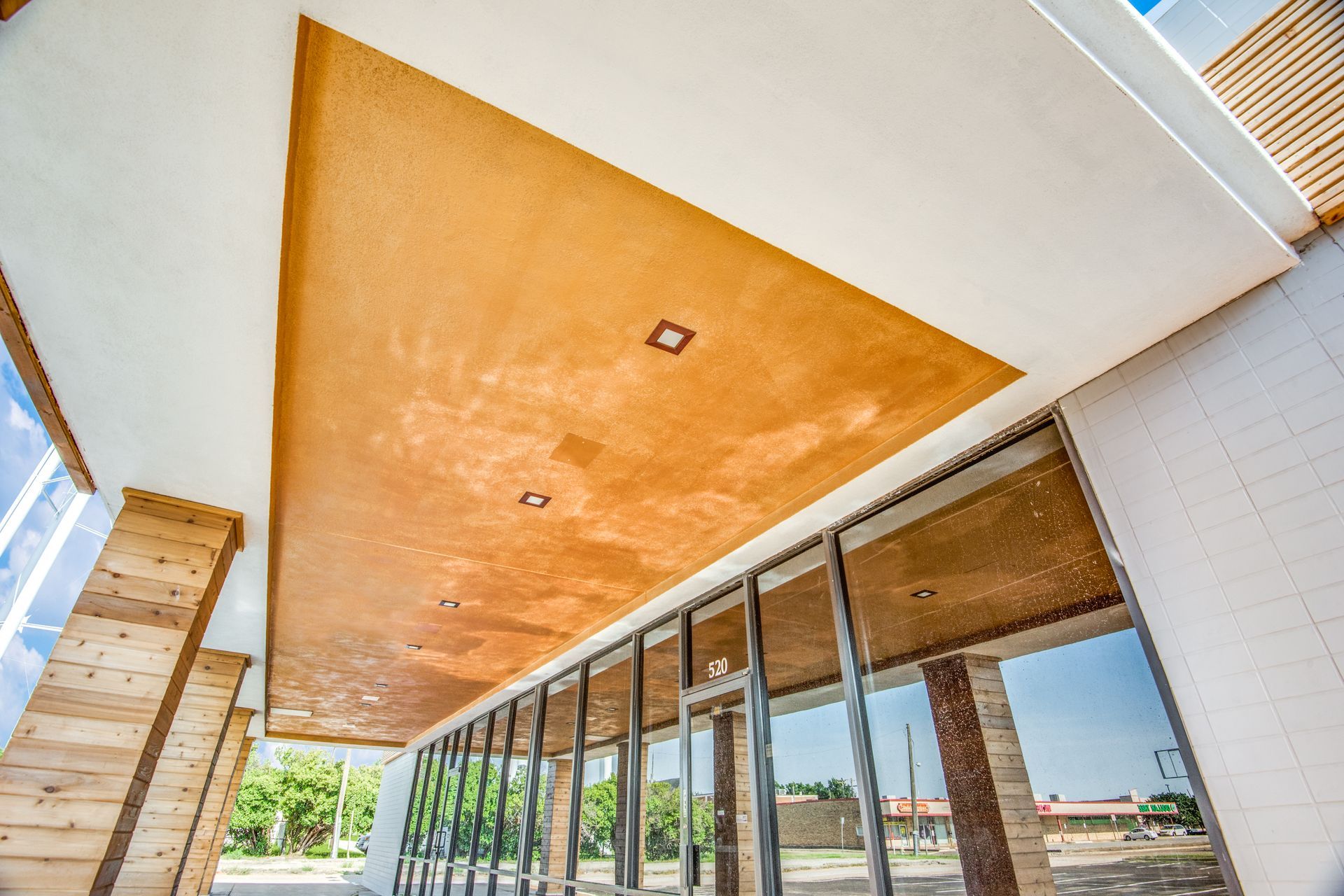 A building with a wooden ceiling and a lot of windows.
