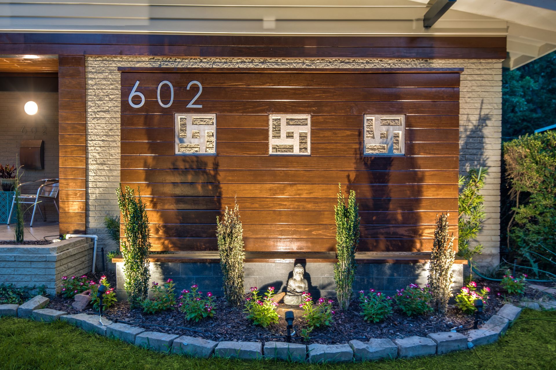 A wooden wall with the number 602 painted on it