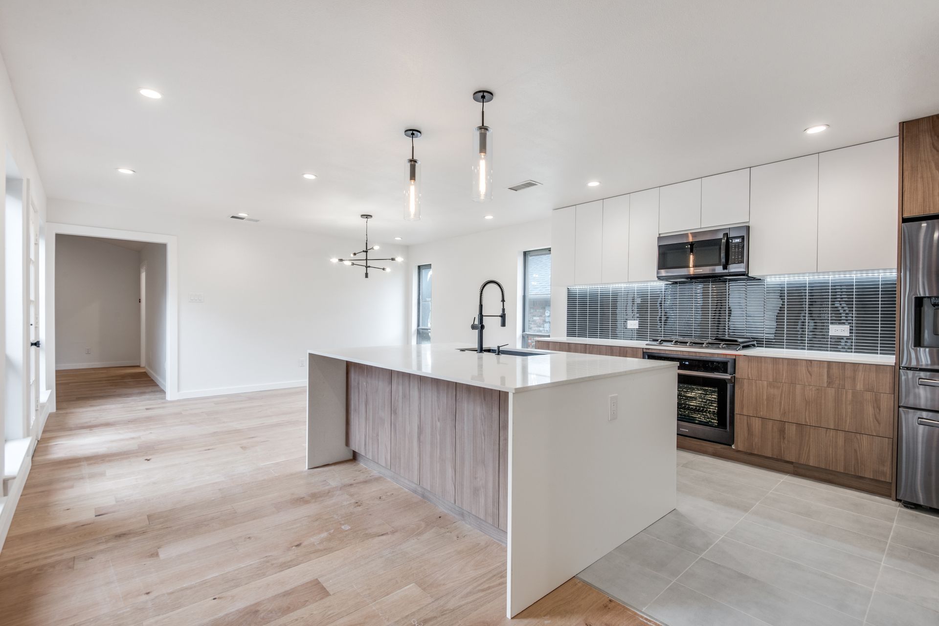 A kitchen with a large island in the middle of the room.