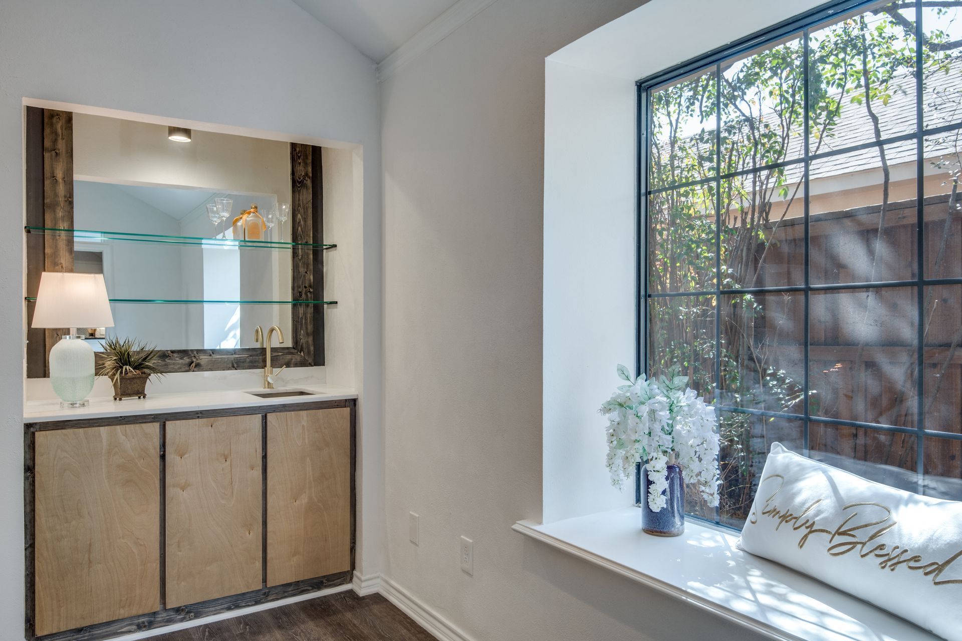 There is a window seat in the corner of the room.