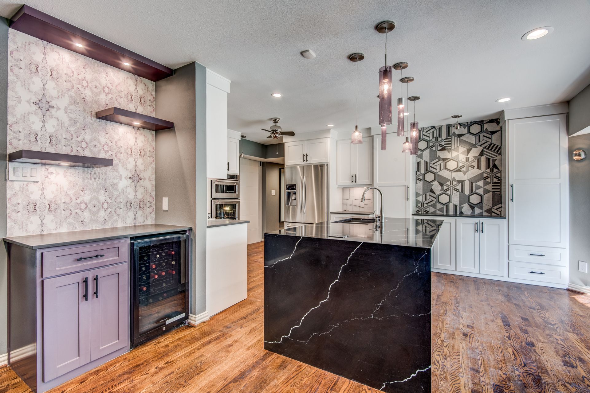 There is a large island in the middle of the kitchen.
