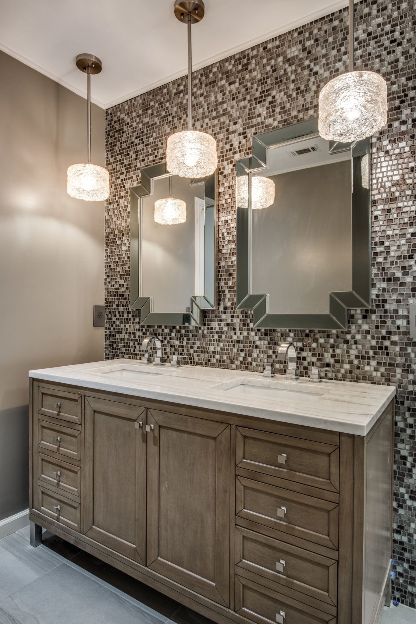 A bathroom with two sinks and two mirrors.