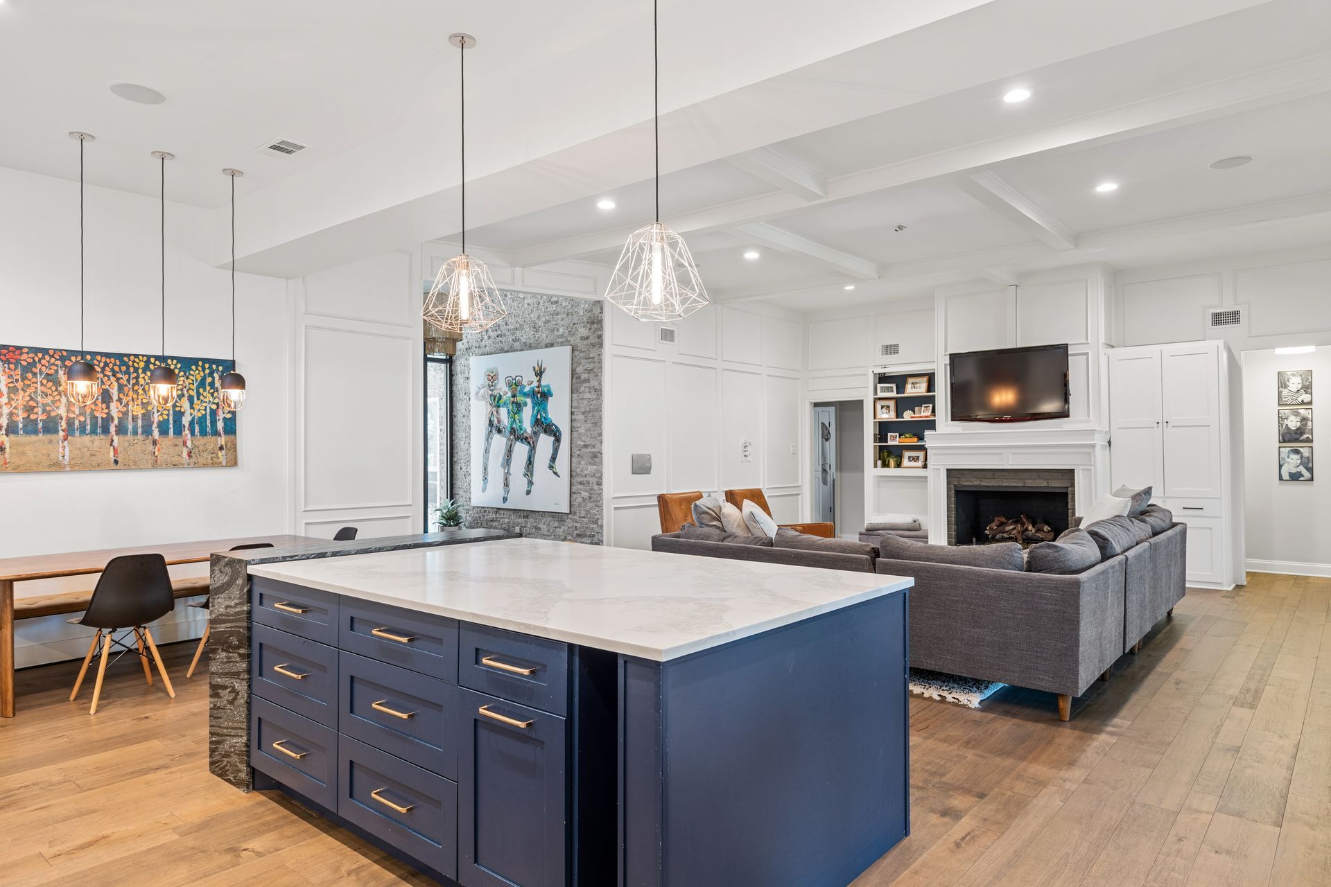 A kitchen with a large blue island in the middle of the room.
