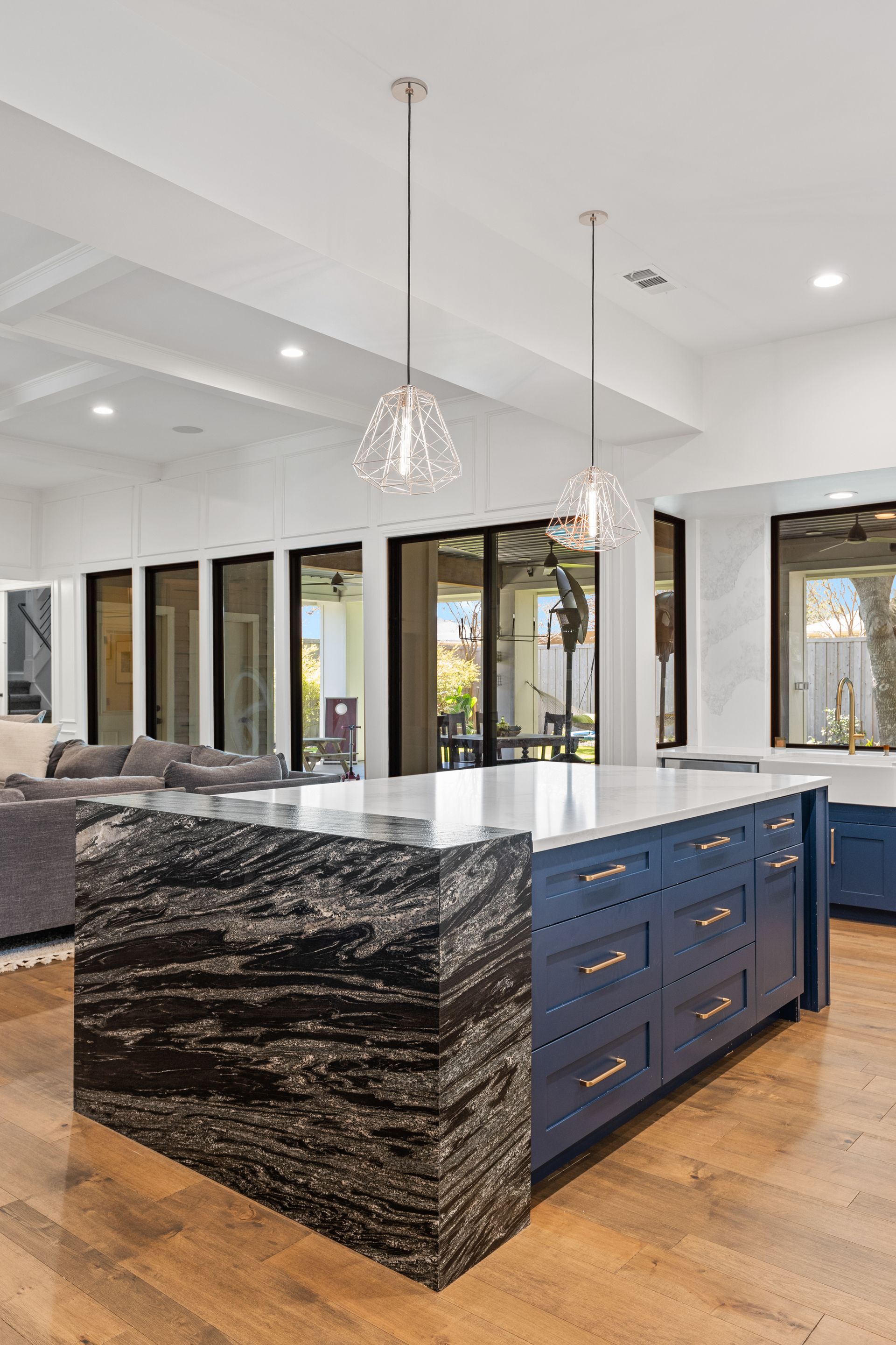 There is a large island in the middle of the kitchen.