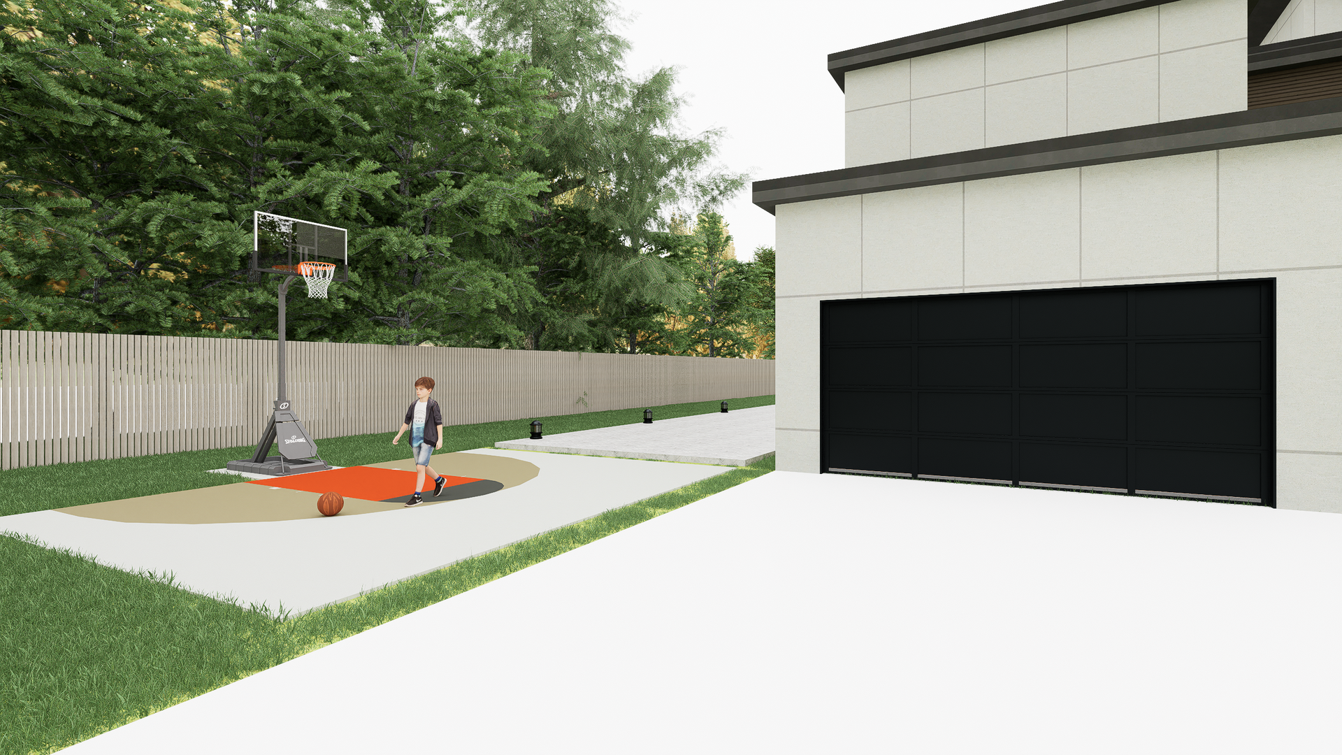 A boy is playing basketball in the backyard of a house.