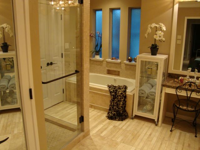 A bathroom with a tub and a mirror