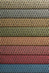 A stack of colorful fabrics with polka dots on them.