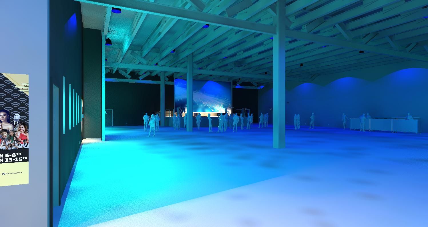 A group of people are standing in a large room with blue lights.