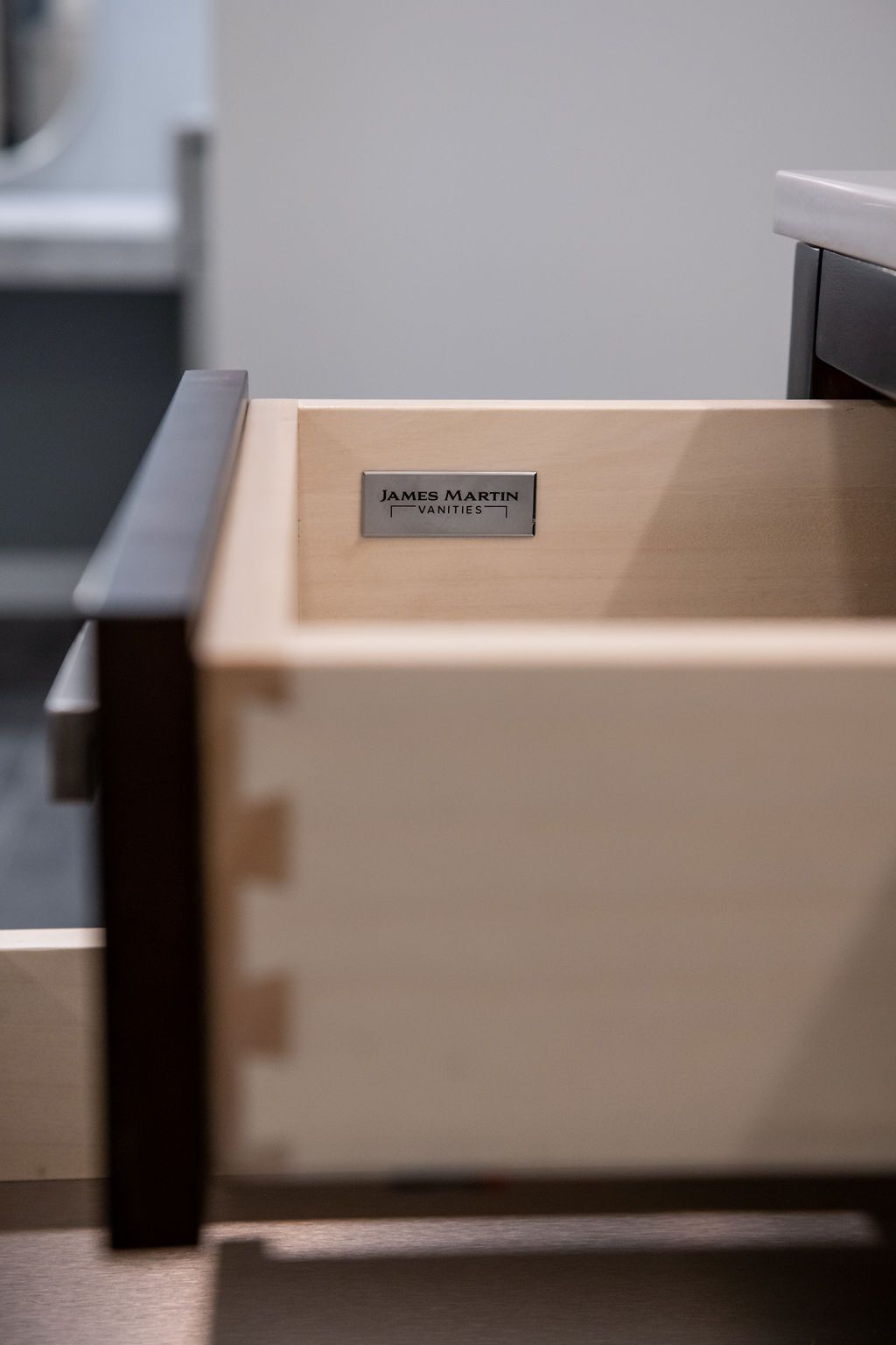 A close up of a wooden drawer with a label on it.