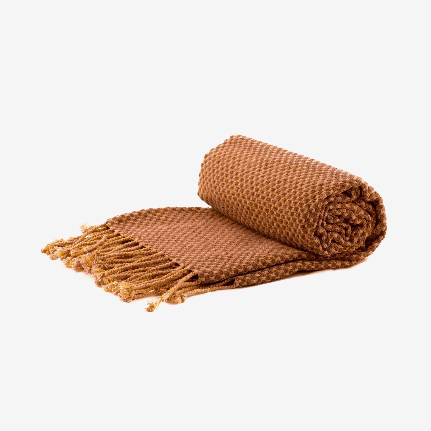 A brown blanket with fringe is rolled up on a white background.