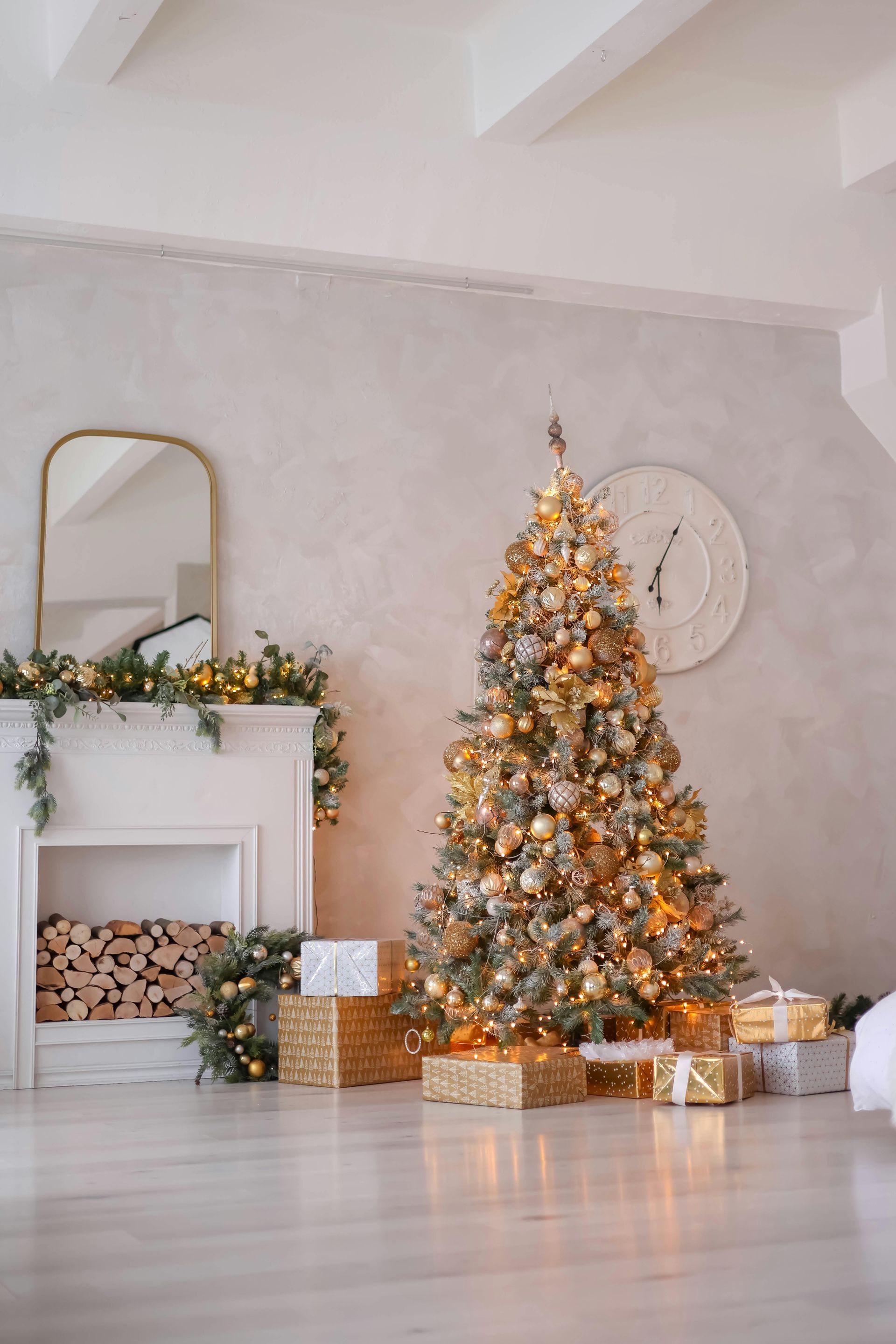 A living room decorated for christmas with a christmas tree and presents.