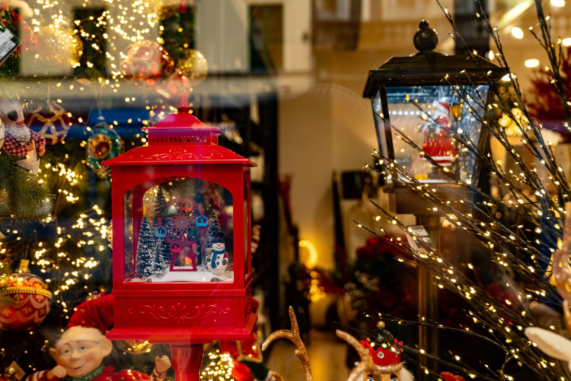 A display of christmas decorations in a store window.
