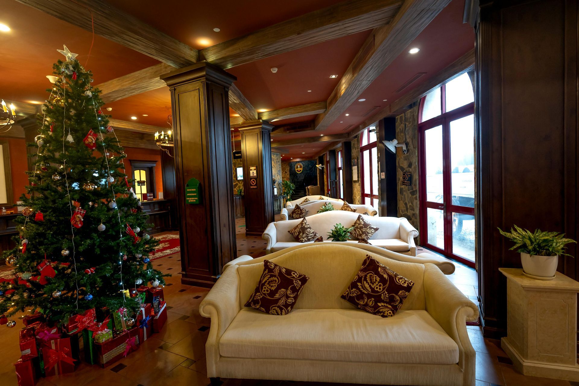 A living room with a couch and a christmas tree