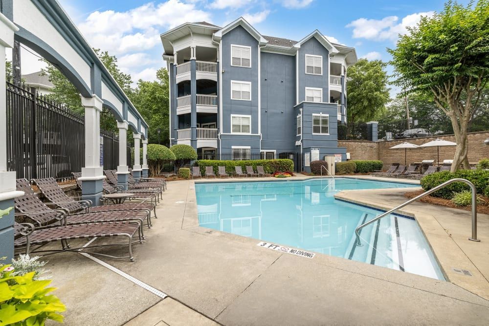 there is a large swimming pool in front of a building at Marquis Midtown West in Atlanta, GA.
