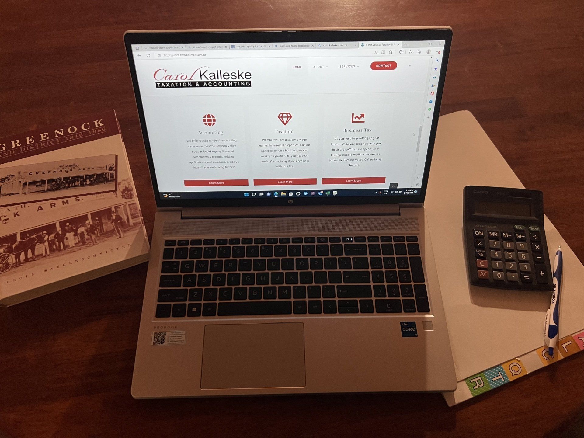 Laptop, Book, & Calculator on the Table — Greenock, SA — Carol Kalleske Taxation & Accounting