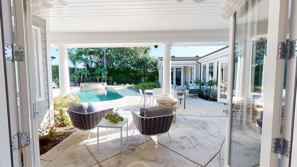 House with Outdoor Swimming Pool — Naples, FL — Antis Media