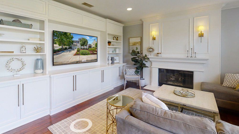White Living Room with Fireplace — Naples, FL — Antis Media