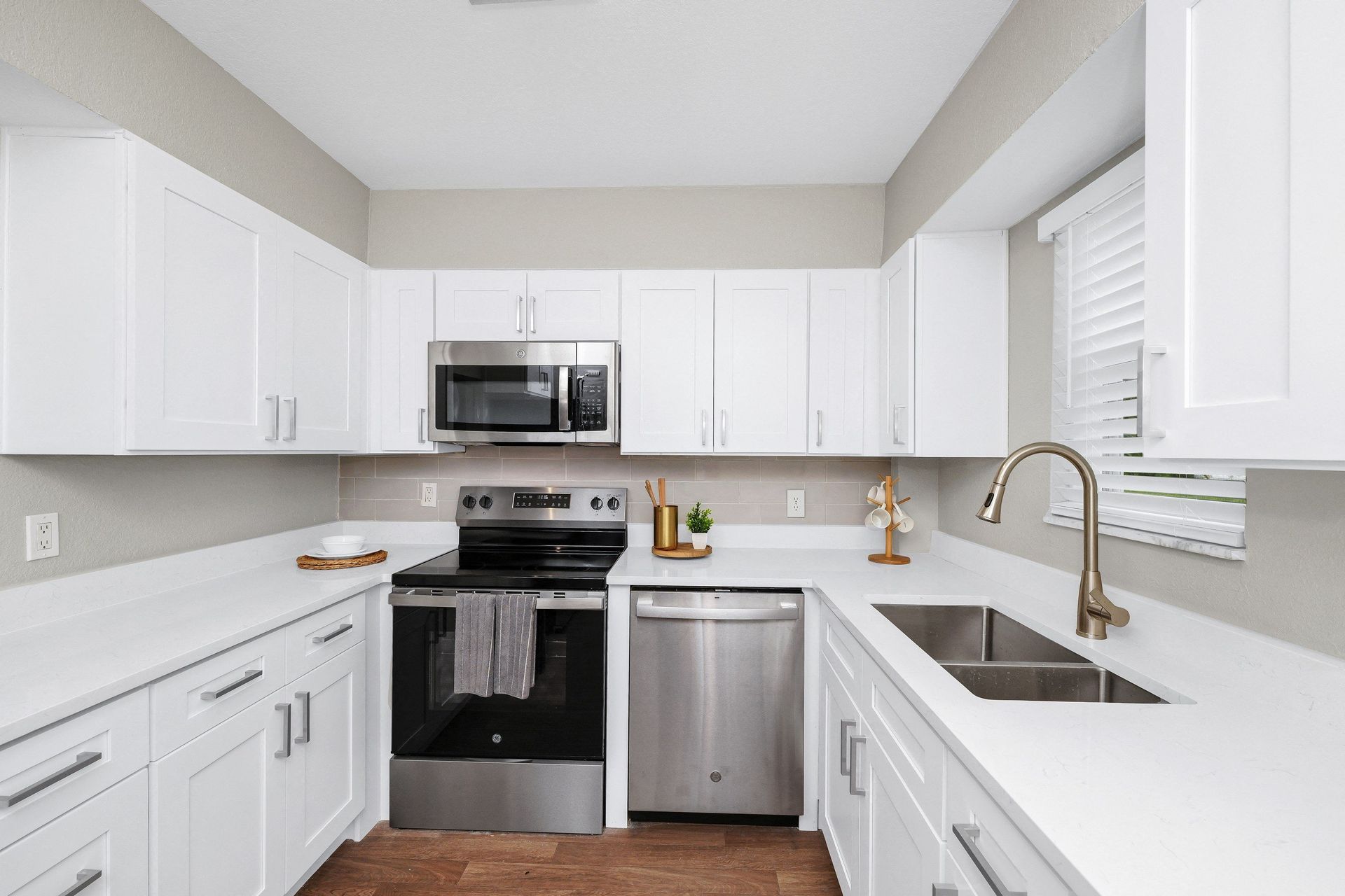 Kitchen with shaker style cabinets and stainless steel appliances