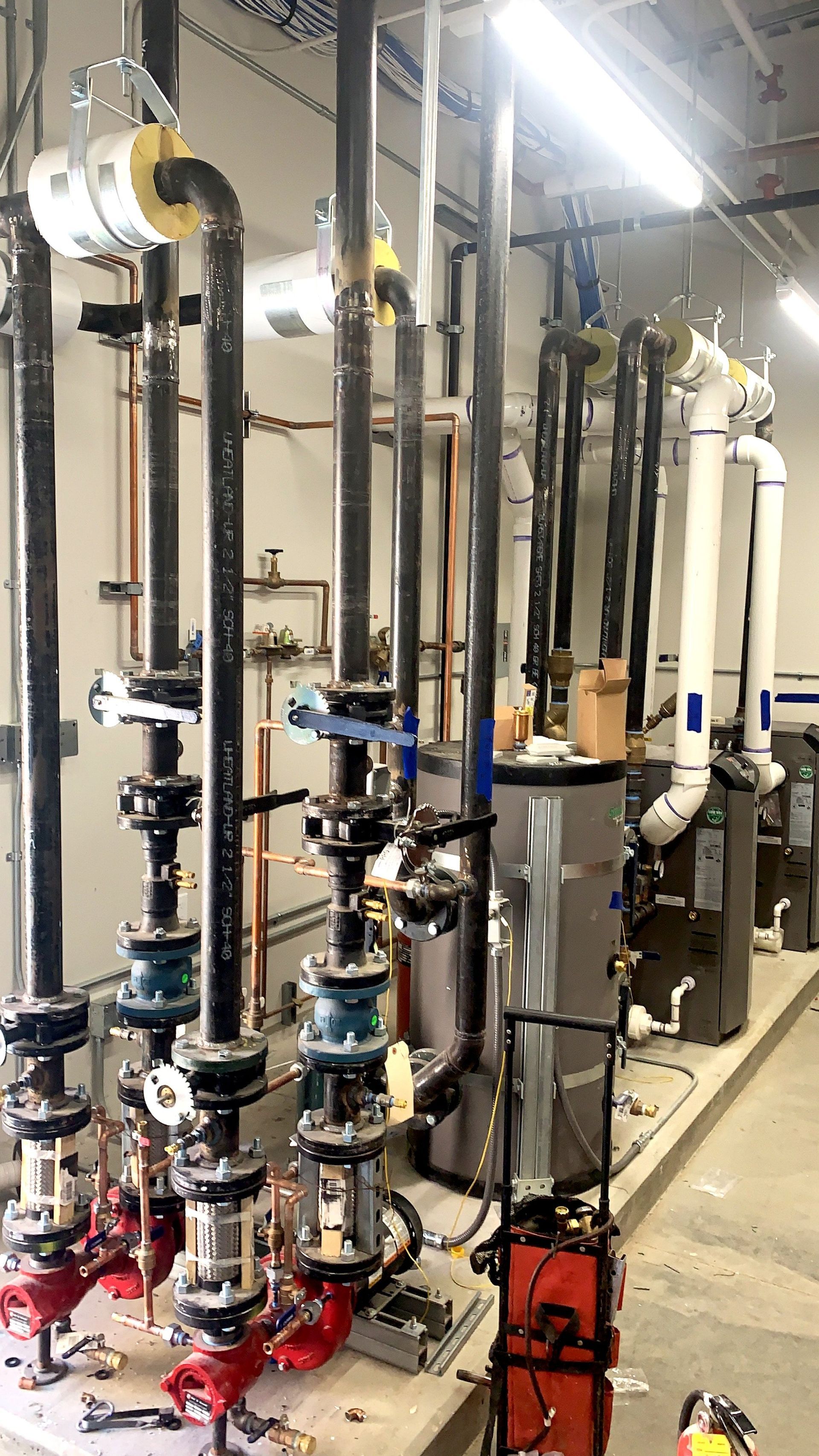 A room filled with lots of pipes and valves.