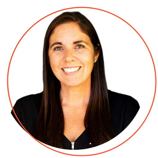Woman with brown hair smiles, framed by an orange circle.