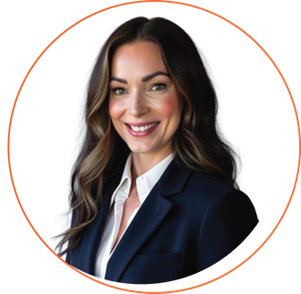 Smiling woman with short blonde hair, wearing a blue-green shirt and layered necklace, outdoors.