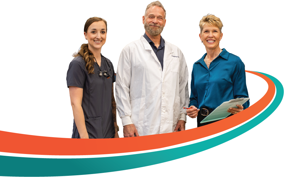Three people, a man in a lab coat holding a clipboard, and two women, smiling, stand near a curved orange and teal line.
