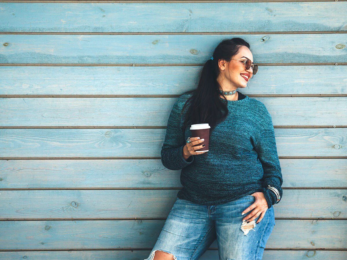 Woman Holding a Cup of Coffee