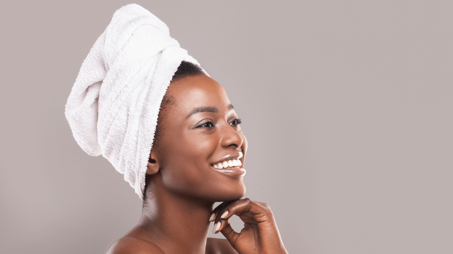 A Woman With A Towel Wrapped Around Her Head