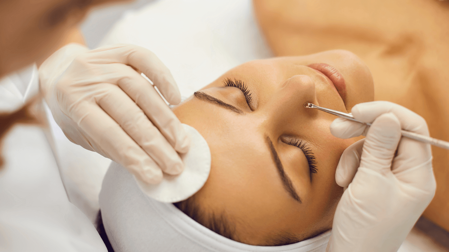 A Woman Is Getting a Facial Treatment at A Spa.