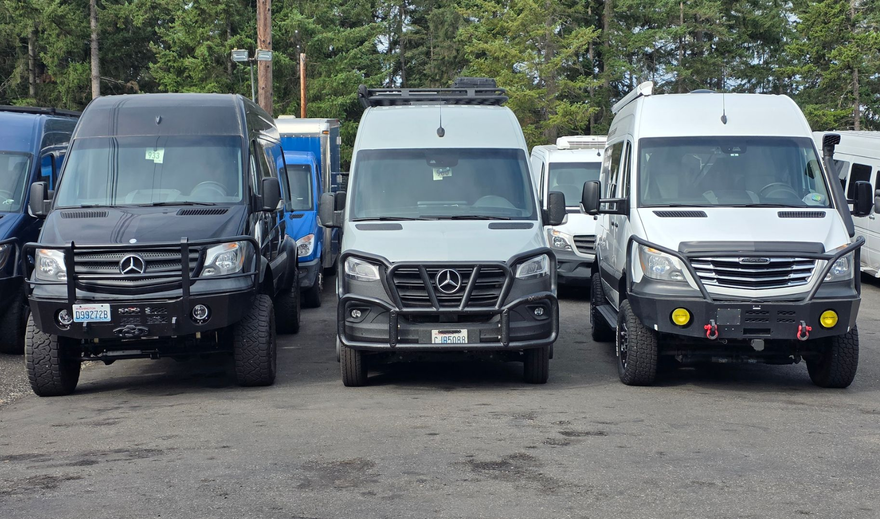 A silver van is parked | The Sprinter Shop, Inc.