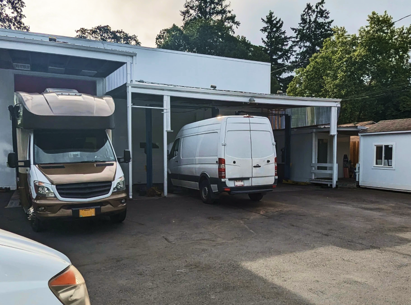 A white van is parked | The Sprinter Shop, Inc.
