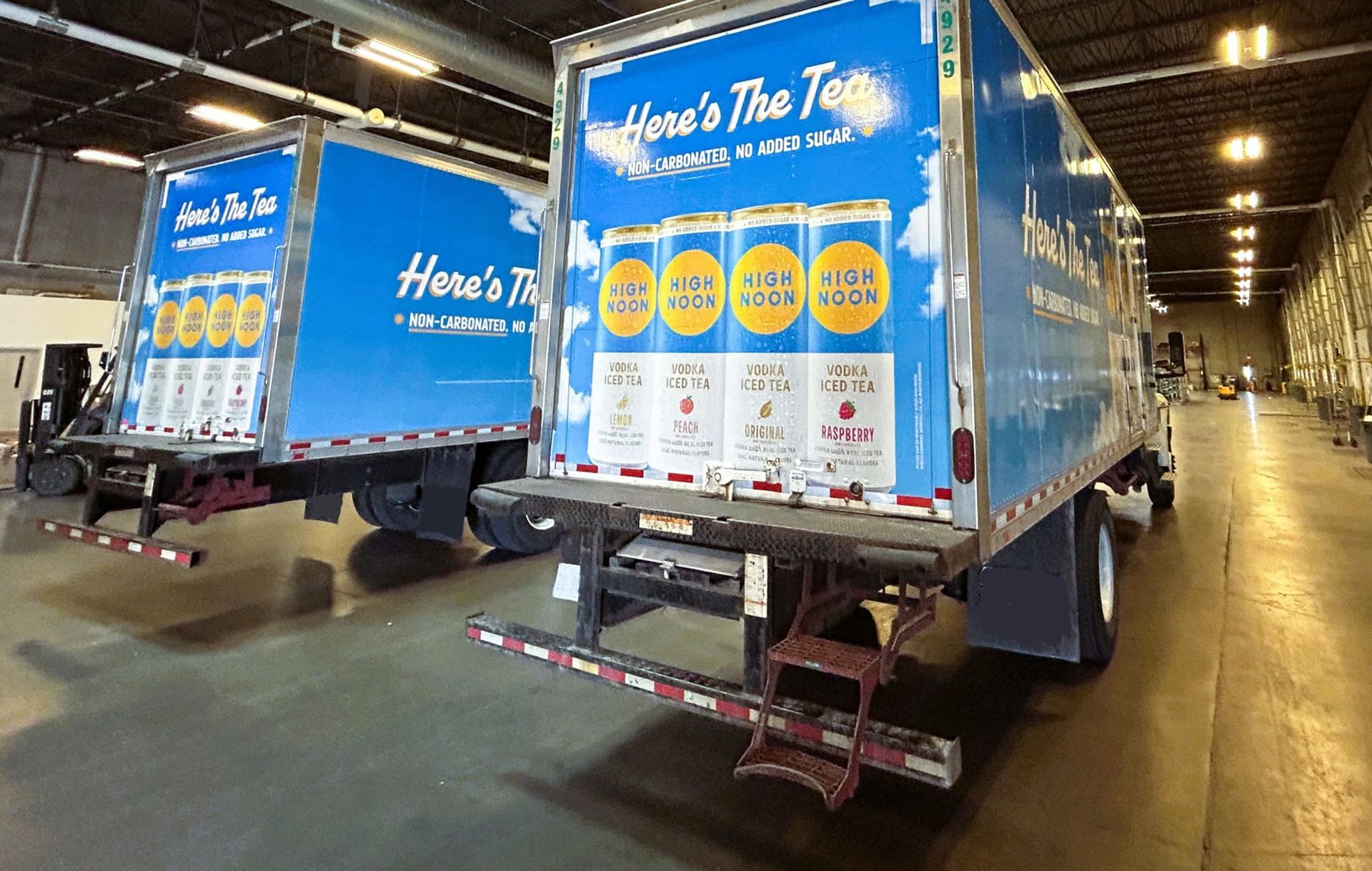 Two delivery trucks with 