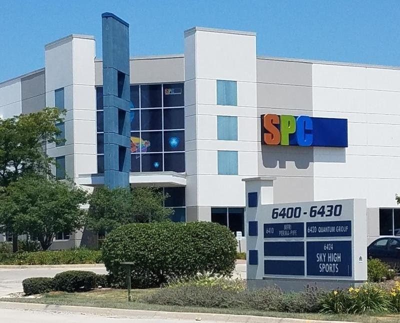 Exterior view of a building for Sky High Sports. The building has blue and white walls with a sign reading 
