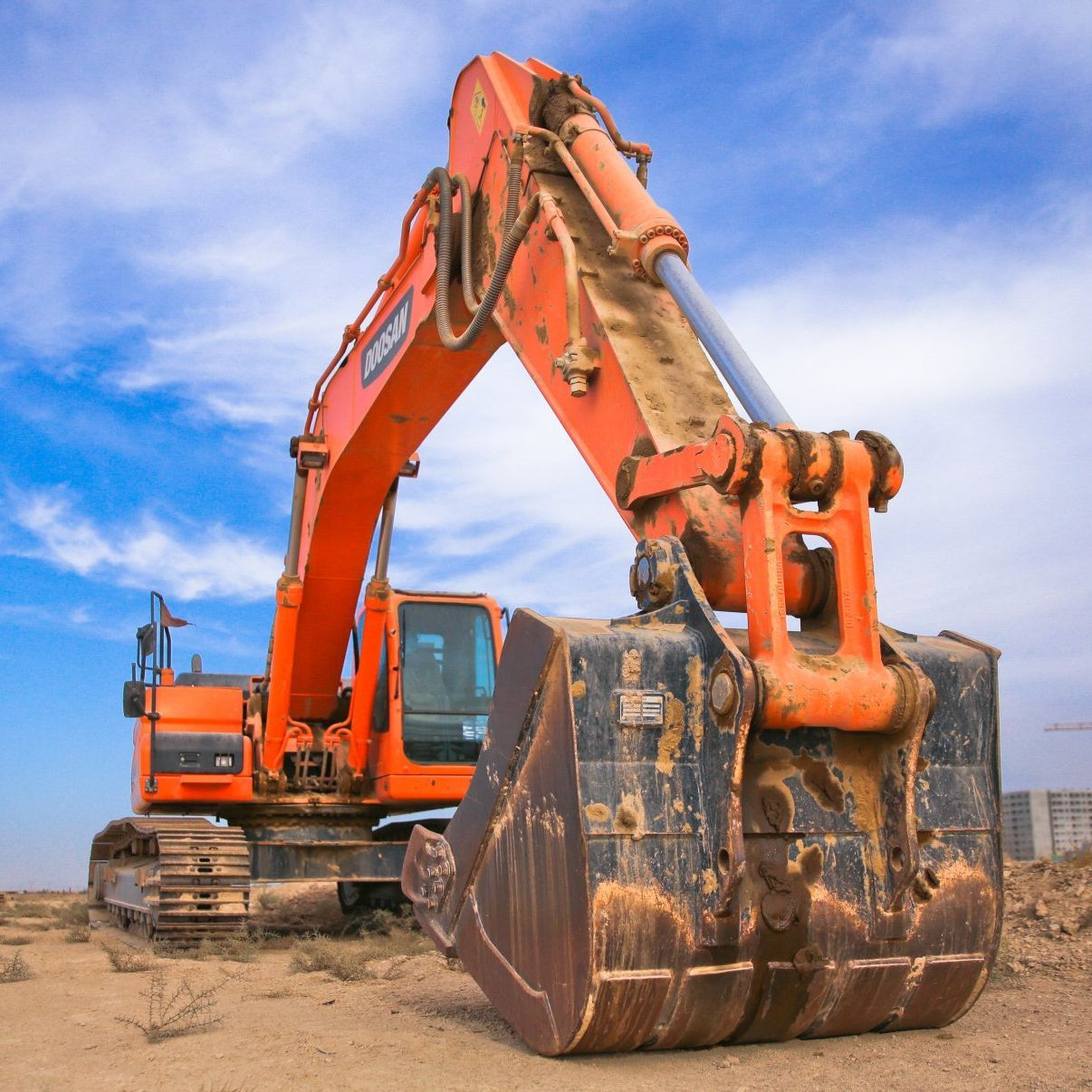 An orange excavator with the word doosan on the side