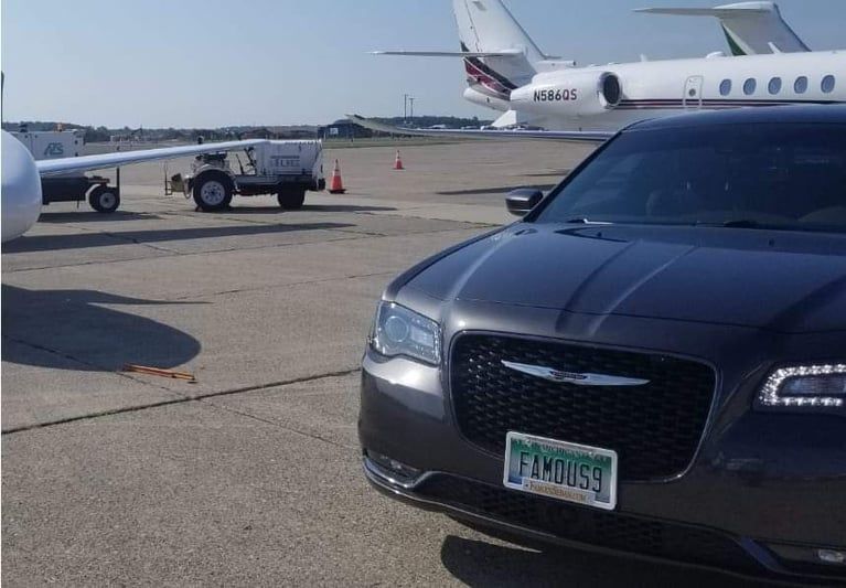 A gray car with a license plate that says fm0859