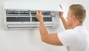 Worker Checking Air Condition — St. Charles, MO — Missouri Furnace & Air Conditioning