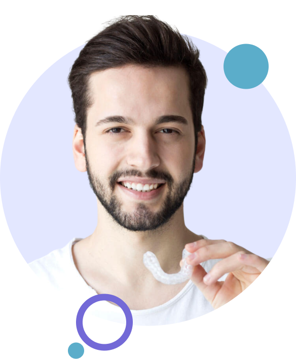 Man holding an Invisalign clear aligner