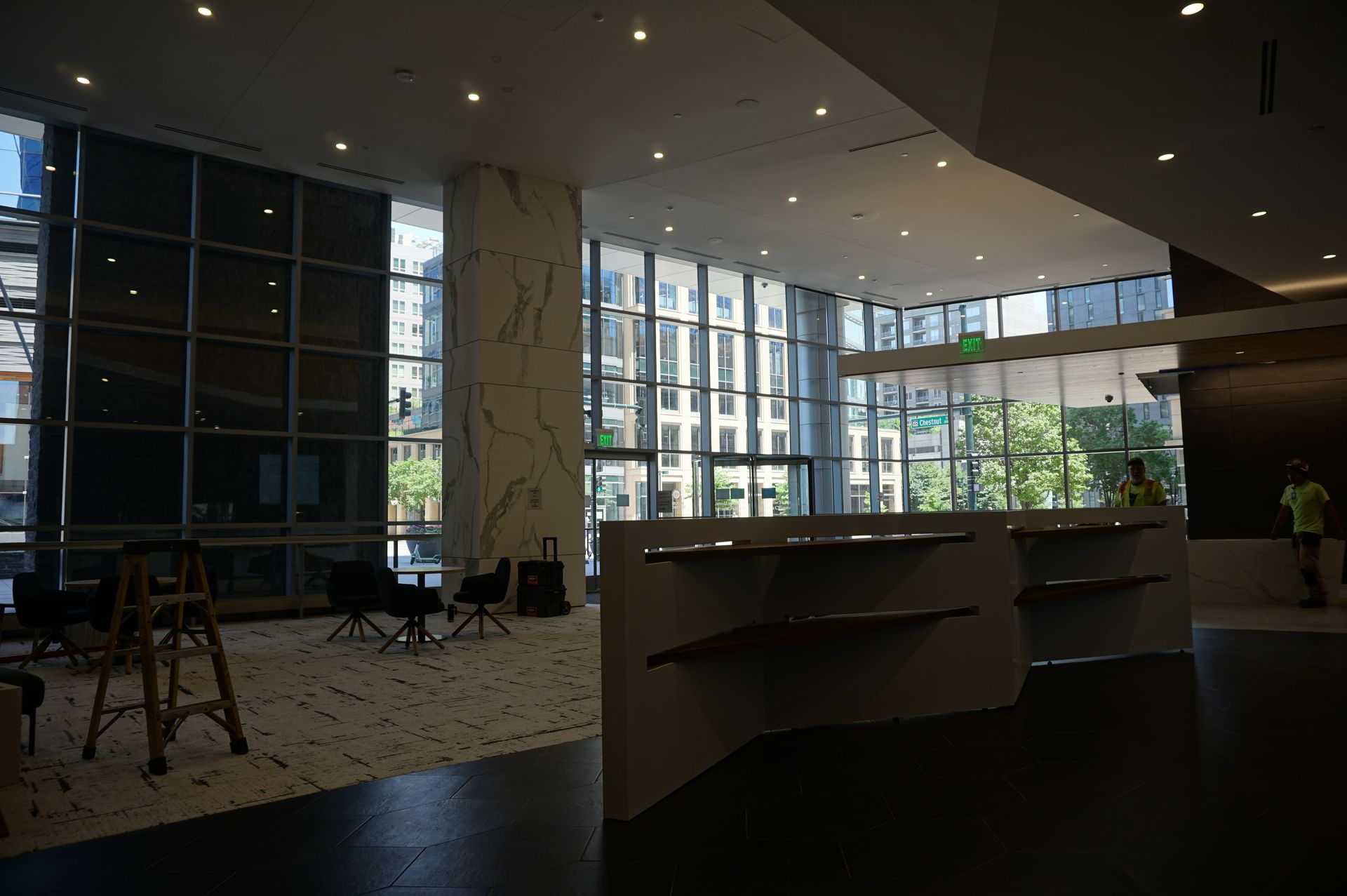 A large room with a lot of windows and a ladder