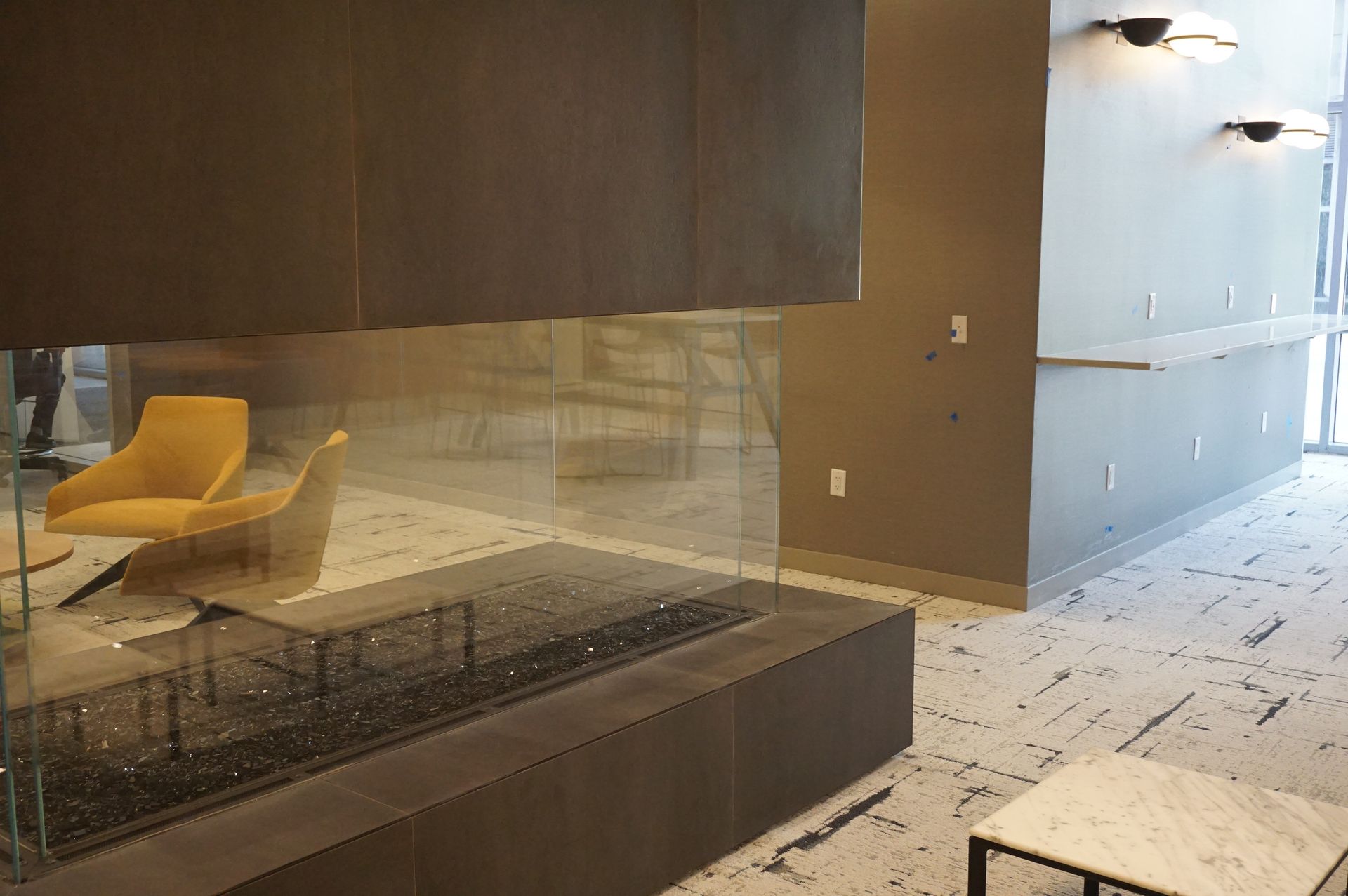 There is a fireplace in the middle of the room.