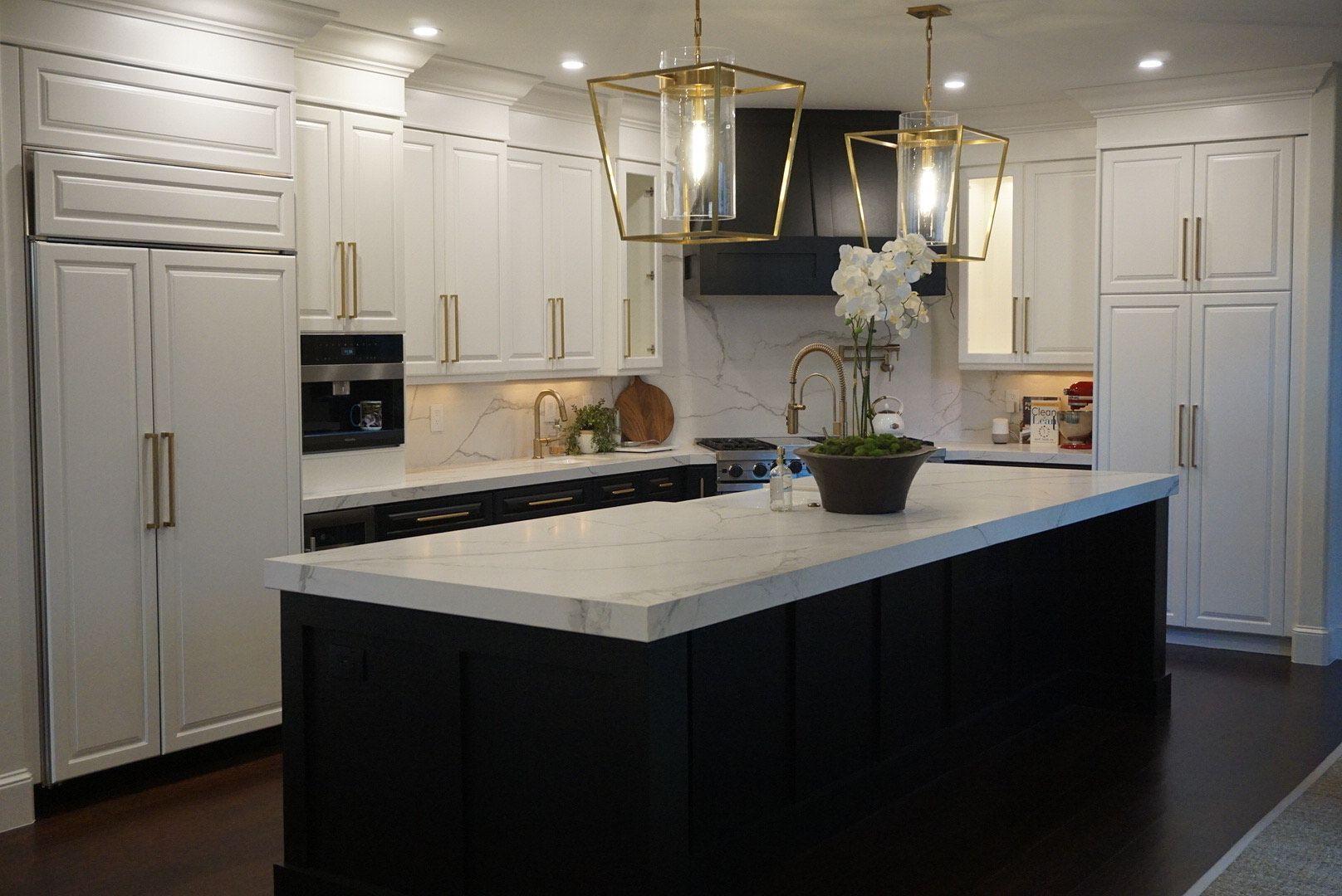 There is a large island in the middle of the kitchen.
