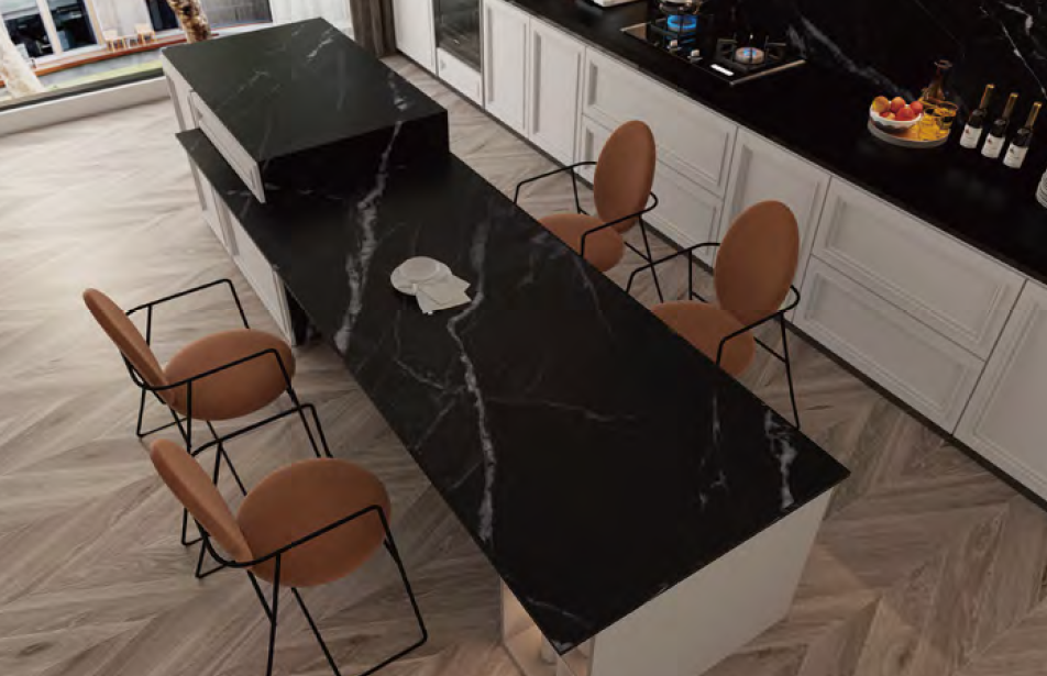 A kitchen with a long black table and chairs.