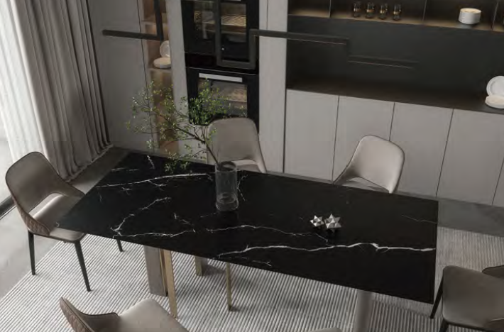 A dining room with a black marble table and chairs.