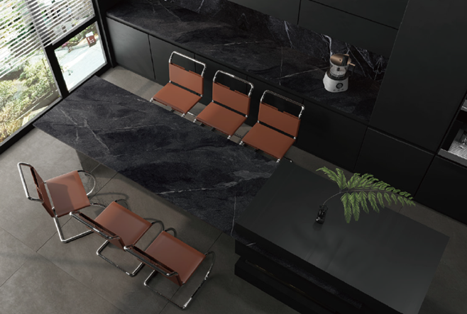 An aerial view of a kitchen with a table and chairs