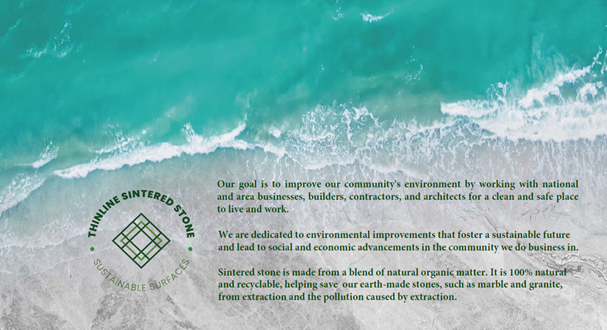 An aerial view of a beach with waves crashing on the shore.