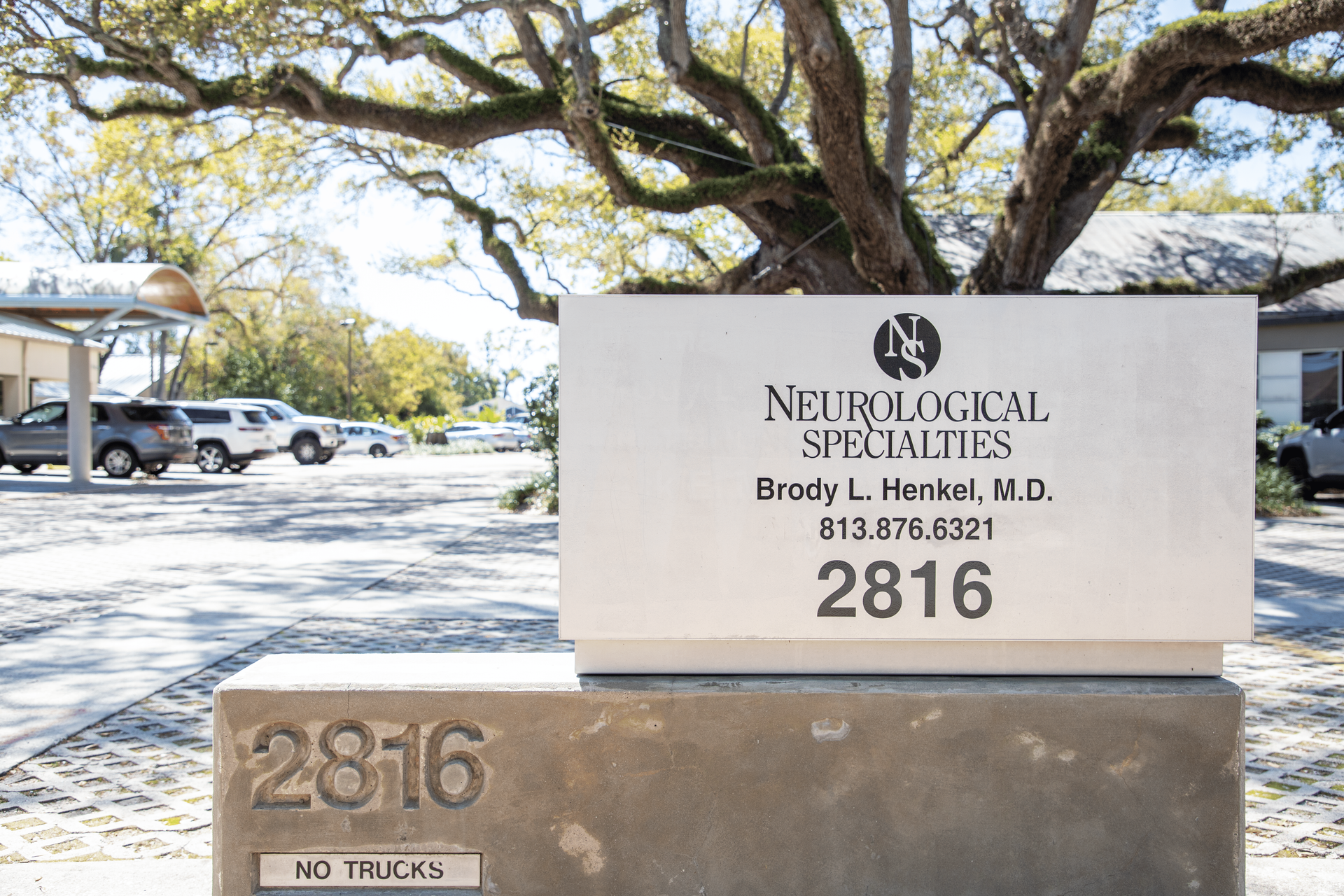 A sign that says neurological specialties on it