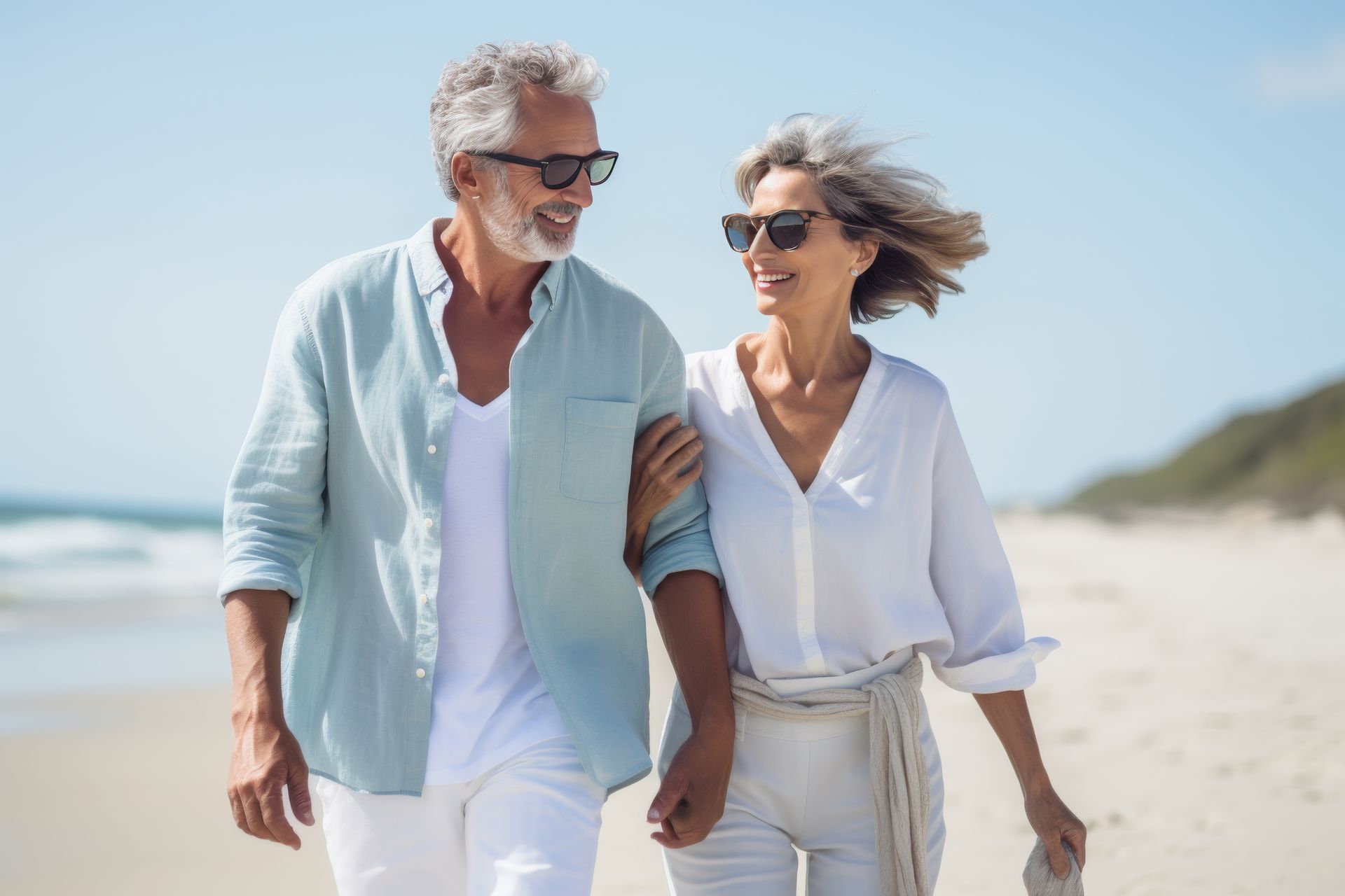 mature couple walking on the beach - tampa florida neurologist